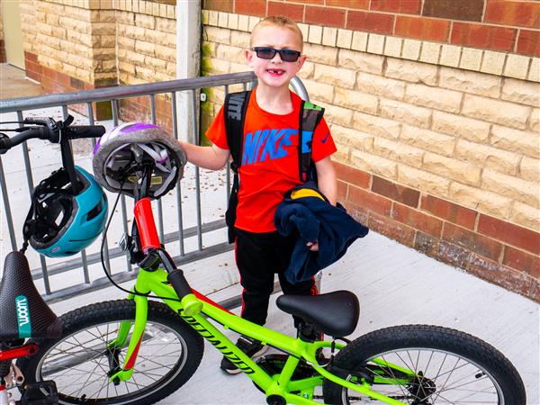 Students bike to school in the morning.